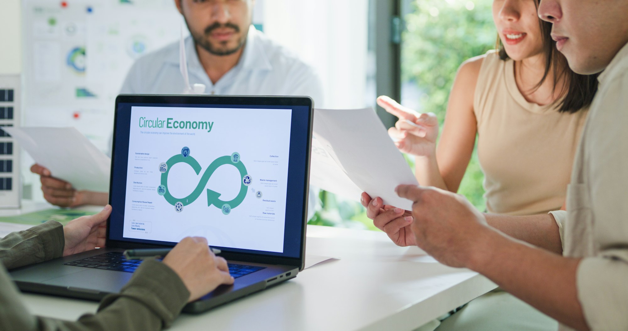 Closeup group diverse Asia businesspeople talk ESG strategies risk management workshop.